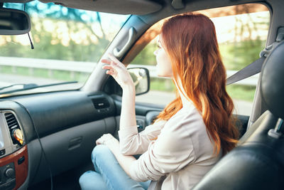 Woman sitting in car