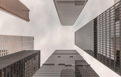 Low angle view of tall buildings against sky