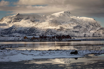 Scenic view of frozen lake against sky during winter