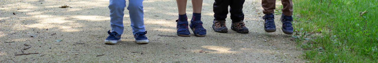 Low section of people standing on ground