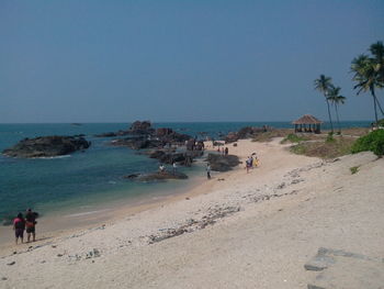 Scenic view of beach against blue sky