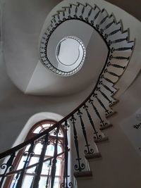 Low angle view of spiral staircase in building