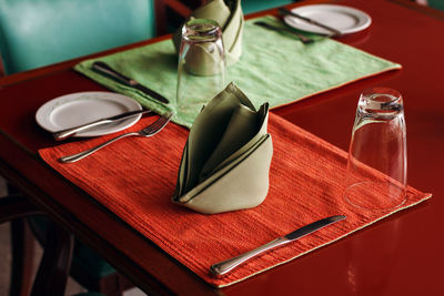 Dining table setting with textile napkin