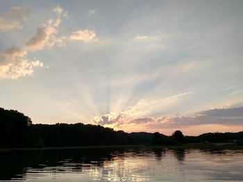 Scenic view of lake at sunset