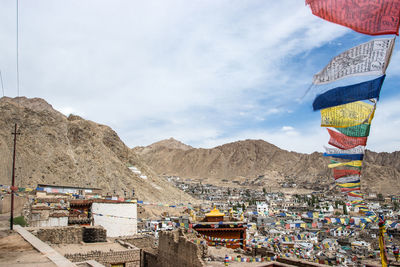 Panoramic view of multi colored buildings against mountains