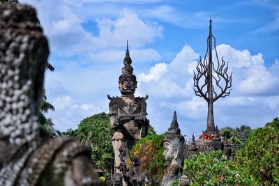 Statue of temple against building