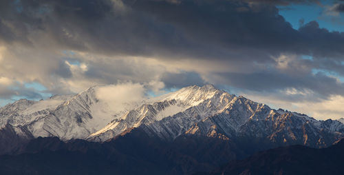 Scenic view of snowcapped mountains against sky