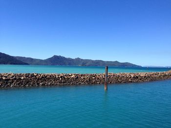 Scenic view of calm sea against clear sky