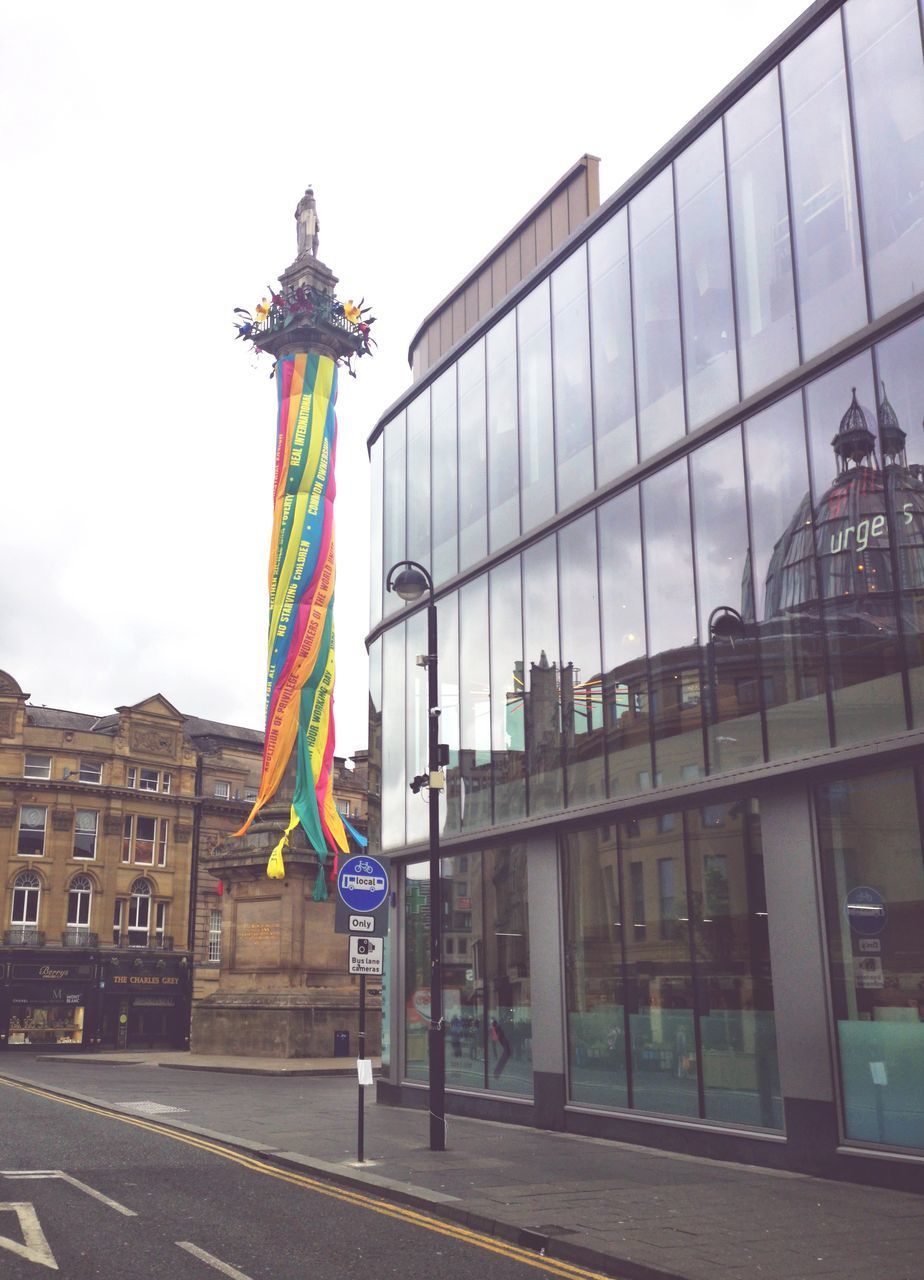 VIEW OF STATUE AGAINST BUILDING