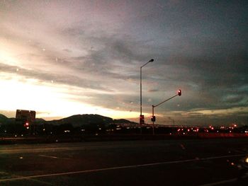 Street lights in city at dusk