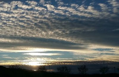 Scenic view of landscape against cloudy sky