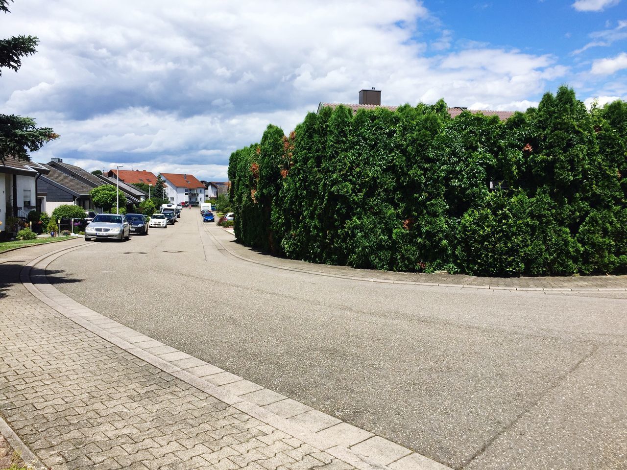 CARS ON ROAD AGAINST SKY