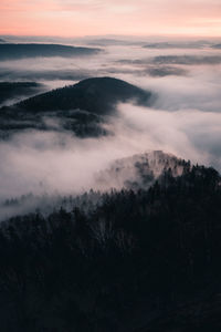 Scenic view of mountain with clouds in the valley