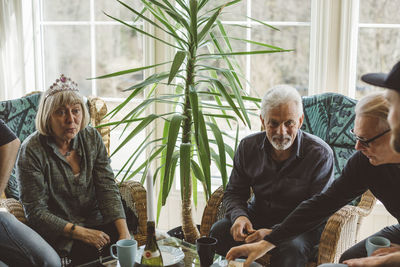 People sitting by table