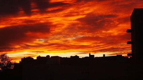 Silhouette of buildings at sunset