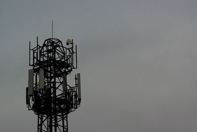 Low angle view of communications tower against sky 5g