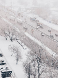 High angle view of snow covered buildings in city