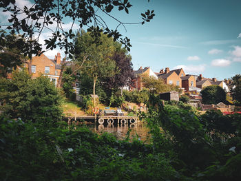 High angle view of trees and buildings against sky