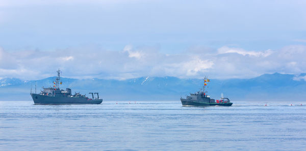 Ship sailing on sea against sky