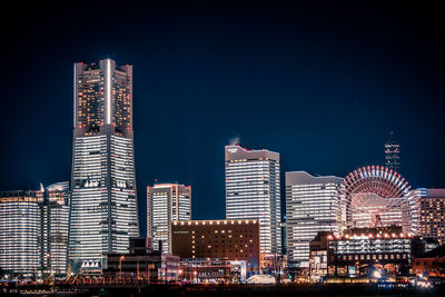 Modern buildings in city at night