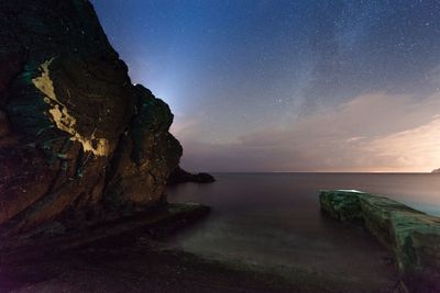 Scenic view of sea against sky at night