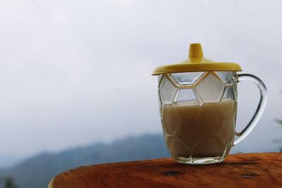 Close-up of milk cup on table