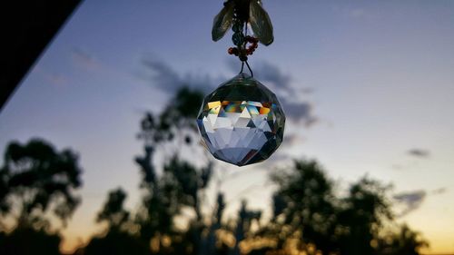 Low angle view of decoration hanging against sky