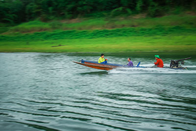 People in boat on river