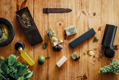 Various herbs, fruits, flowers and spices on wooden table