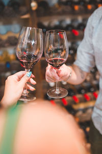 Cropped hand of woman holding wineglass