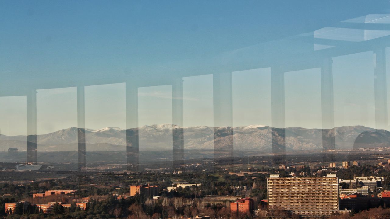 sky, architecture, city, cityscape, built structure, air pollution, building exterior, skyscraper, urban skyline, travel destinations, outdoors, no people, smoke - physical structure, nature, downtown district, day