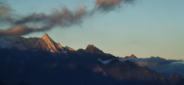 Scenic view of mountains against sky during sunset