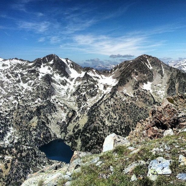 mountain, snow, mountain range, tranquil scene, winter, tranquility, cold temperature, scenics, beauty in nature, sky, snowcapped mountain, landscape, nature, blue, season, non-urban scene, rock - object, rocky mountains, physical geography, idyllic