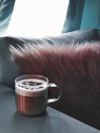 Close-up of coffee cup on table