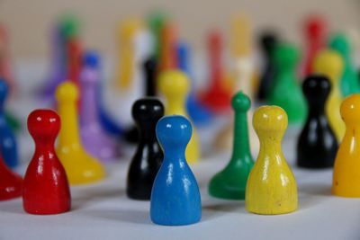 Close-up of chess pieces on table