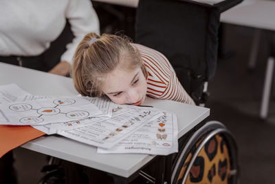Girl on wheelchair in classroom