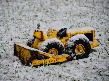 Close-up of yellow snow on ground