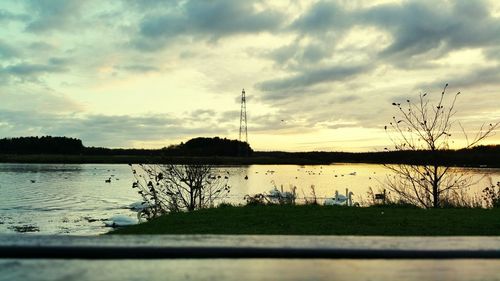 Scenic view of lake against cloudy sky