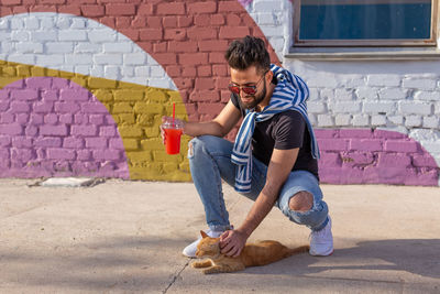 Full length of man holding wall