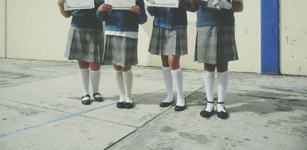 Low section of girls in school uniform