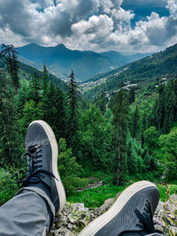 Low section of man on mountain road