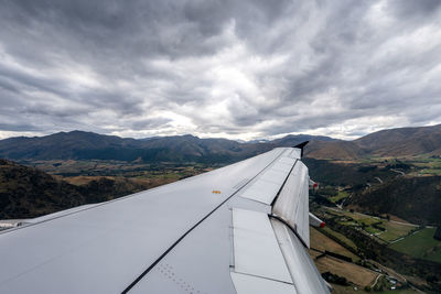 Aerial view of landscape and mountains against sky