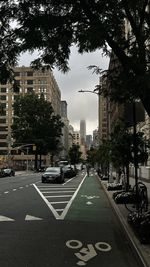 City street and buildings against sky