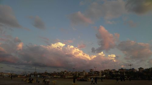 Panoramic view of people at sunset