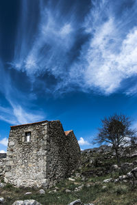 Low angle view of old building against sky