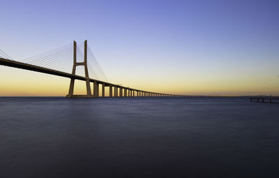 View of suspension bridge over sea