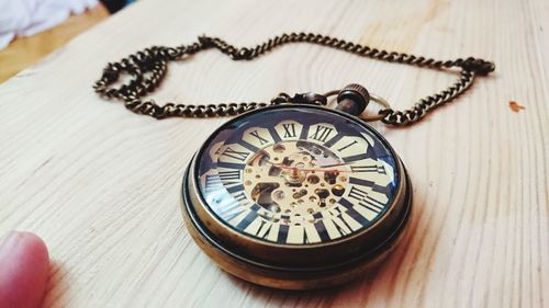 High angle view of clock on table