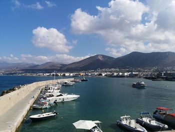 Sailboats moored in bay