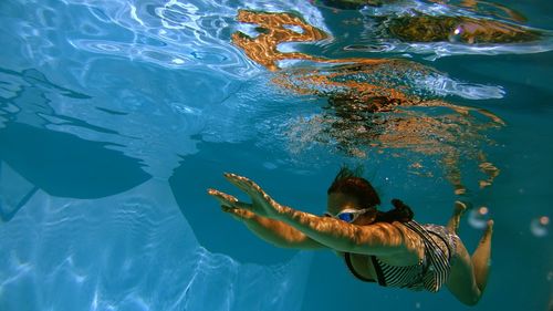 Full length of woman swimming in water