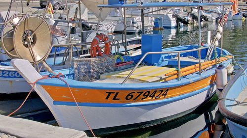 Fishing boats moored at harbor